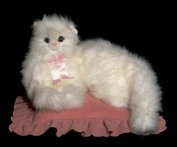 Cat on a pink cushion